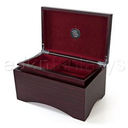 A wooden jewelry box with hidden sex toy compartment and secret magnet key.